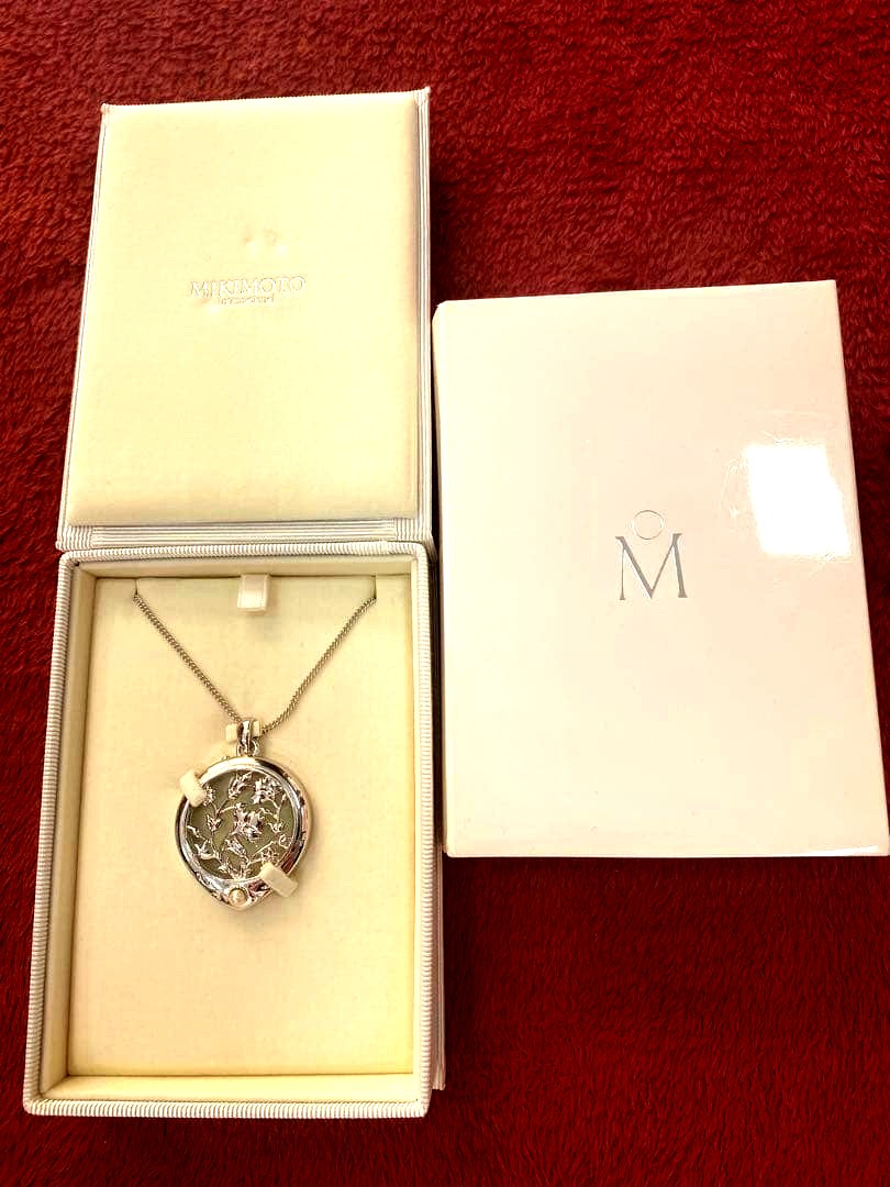 Mikimoto Loupe Pearl Necklace displayed with pearls and elegant design on a white background