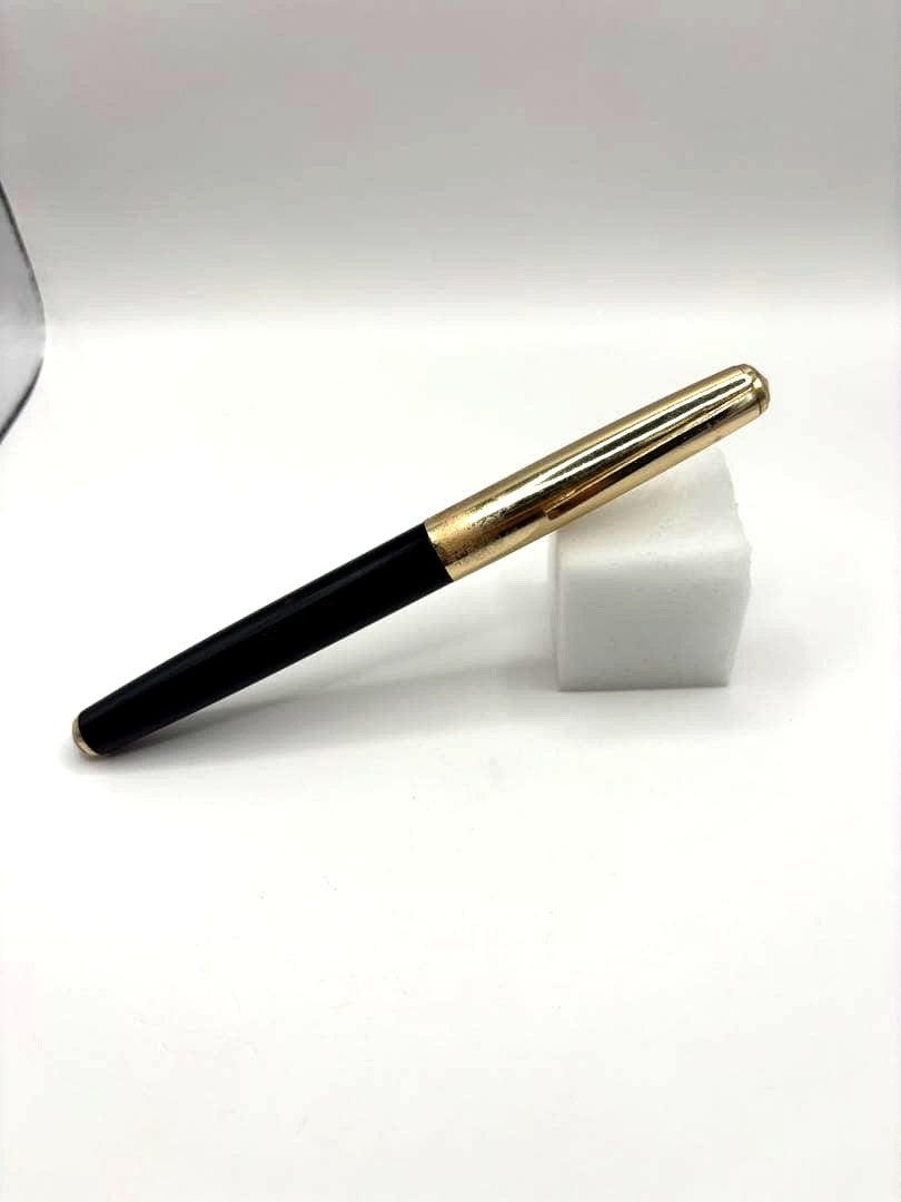 PILOT black fountain pen with 14k engraving and shiny gold cap shown on white background