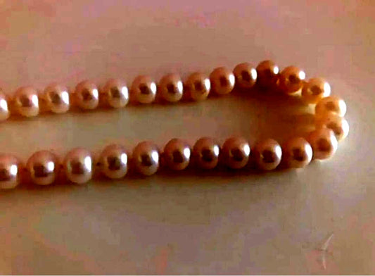 14K gold necklace with oval Akoya pearls showing aurora-like luster and beautiful shine