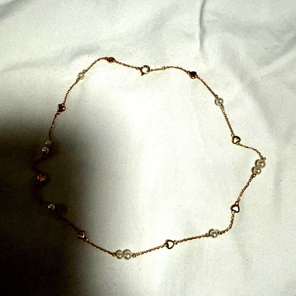 K18YG Heart Motif Pearl Necklace made of 18K gold with a heart design and a single pearl pendant