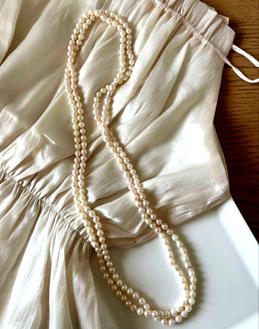 Akoya pearl ultra long necklace with 6.5-7mm off white pearls measuring 162cm in length featuring 2-3 strands