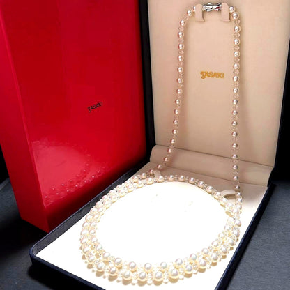 TASAKI Pearls Vari Aoyama 120cm pearl necklace with crystal clasp and silver marking on white background