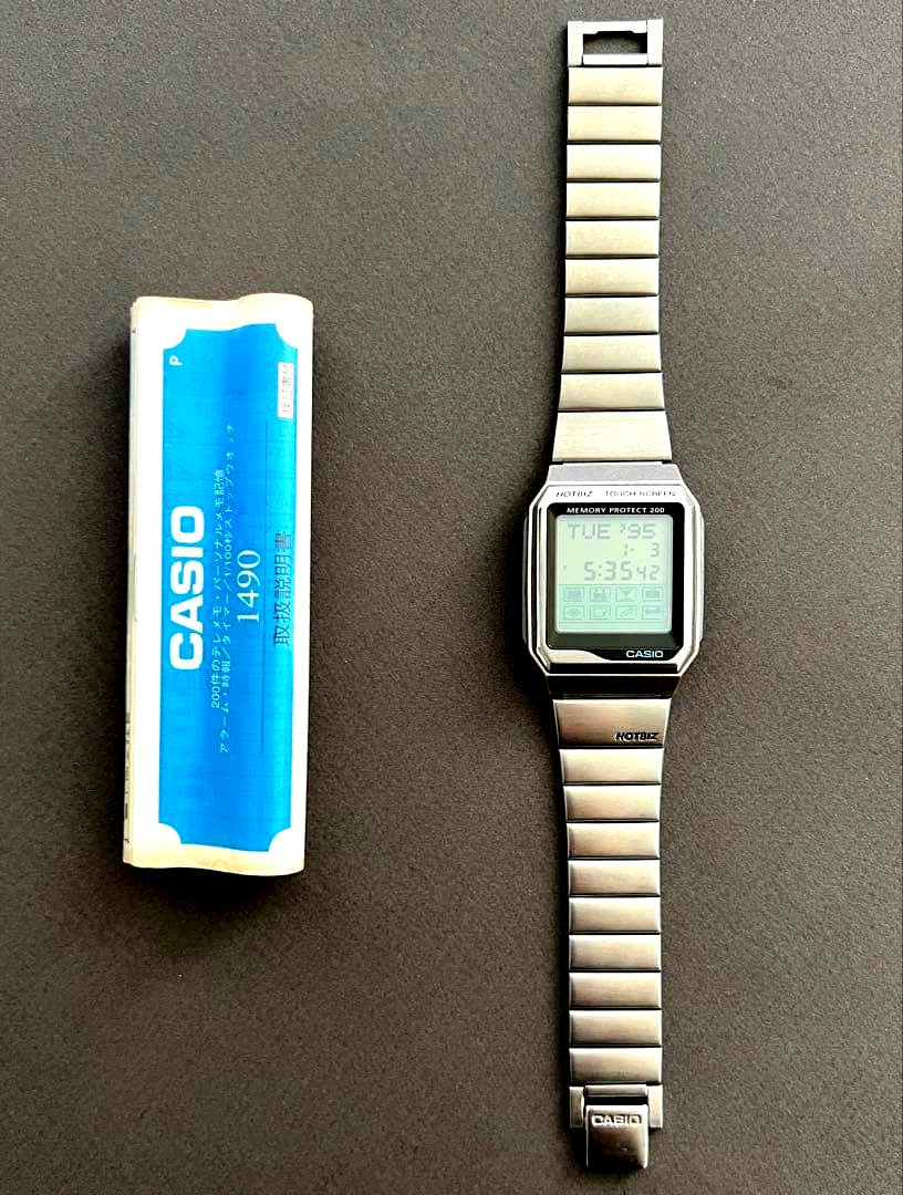 Casio HotBiz VDB-2000 touch screen digital data bank watch showing black case and digital display