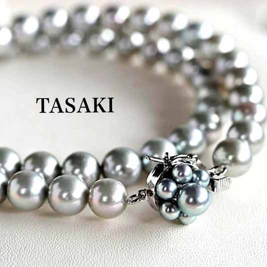 Tasaki Natural Blue Akoya Pearl Necklace 41 cm length with round pearls and silver clasp on white background