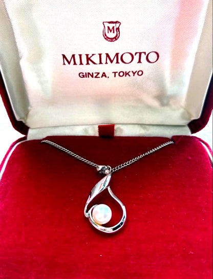 Mikimoto silver pendant necklace with a single pearl, displayed with dedicated jewelry case