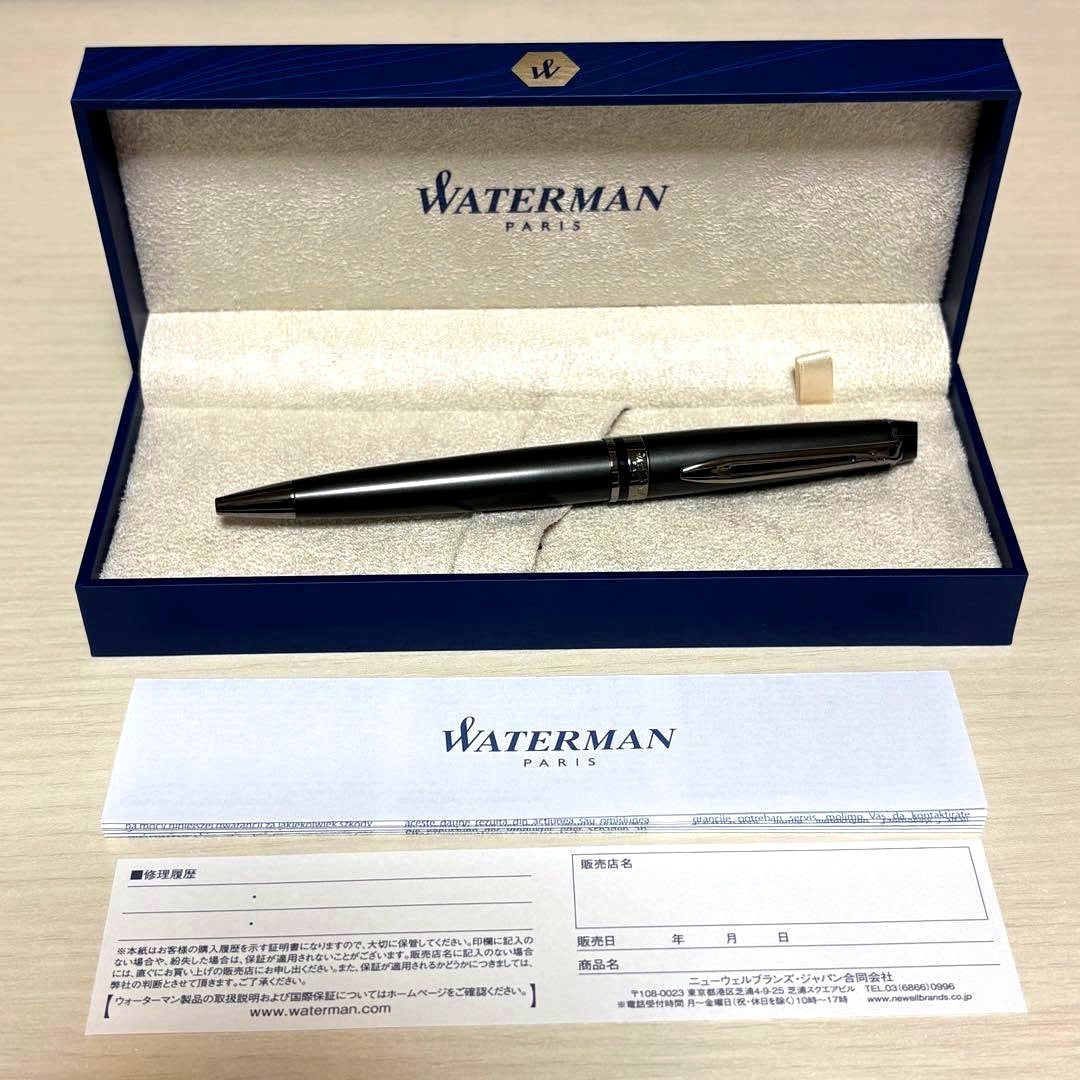 WATERMAN Expert Metallic Black ballpoint pen with included accessories on white background