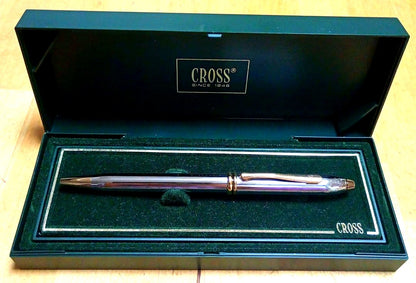 Cross ballpoint pen with metal body and blue ink displayed with its dedicated case and manual