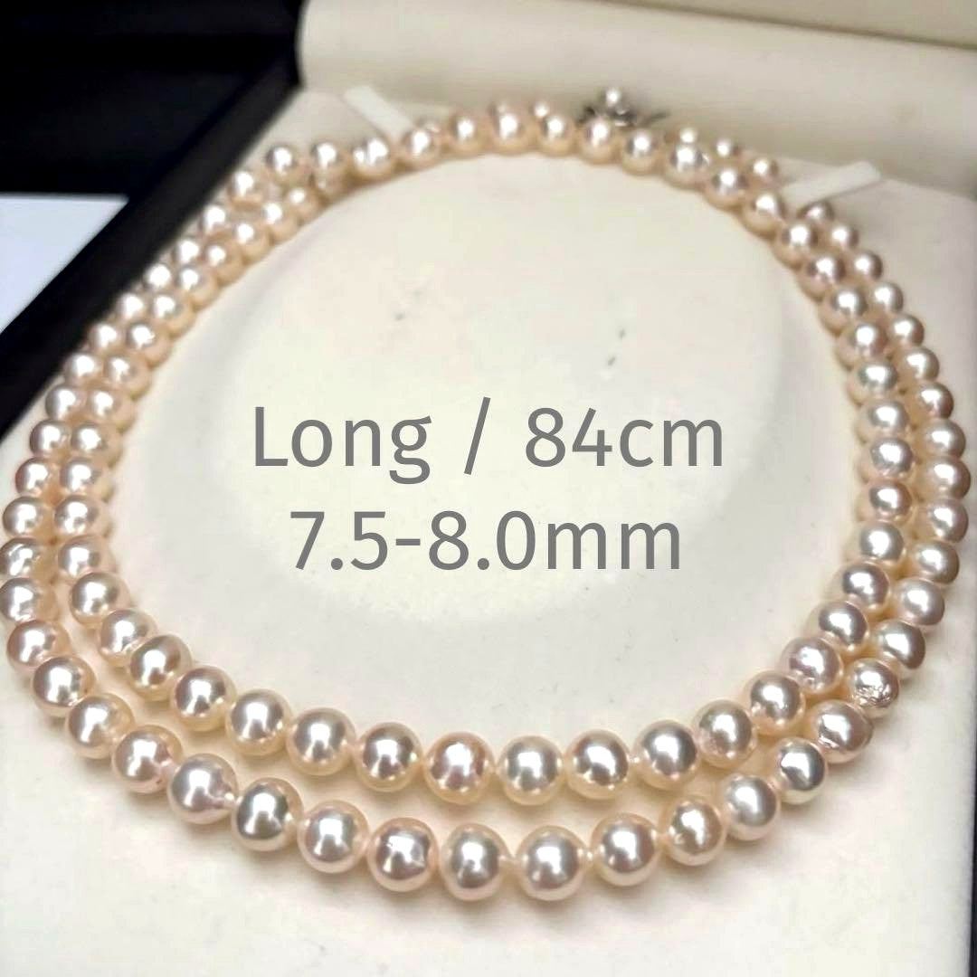 Long double-strand pearl necklace with large Akoya pearls and aurora interference colors in champagne or white gold