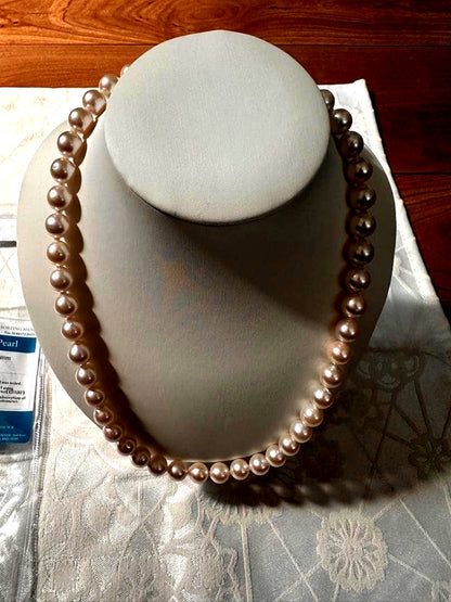 Akoya pearl necklace with 8.0-8.5mm white pearls and silver stamped clasp with certification tag