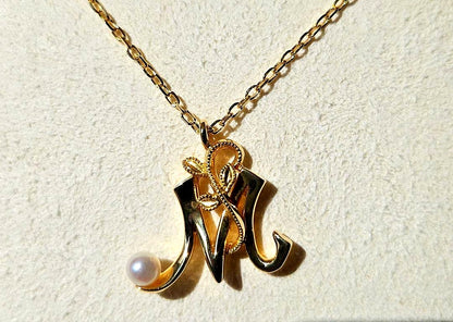 Mikimoto Baby Pearl Necklace with Initial M pendant in 18K yellow gold, 42cm chain, displayed with box