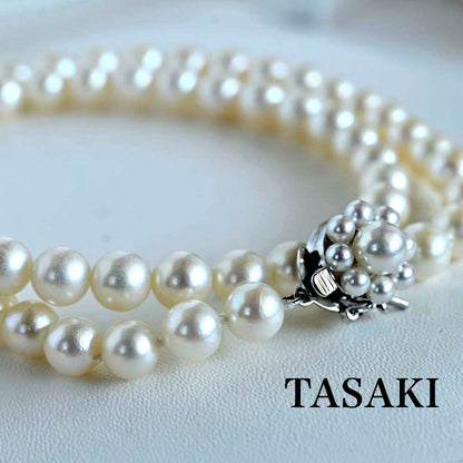 Takaski pearl necklace featuring 6.5mm Akoya round pearls and silver clasp on a white background