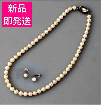 6.5mm Akoya pearl necklace approximately 42cm with matching earrings 13x6.5mm featuring natural pearl markings