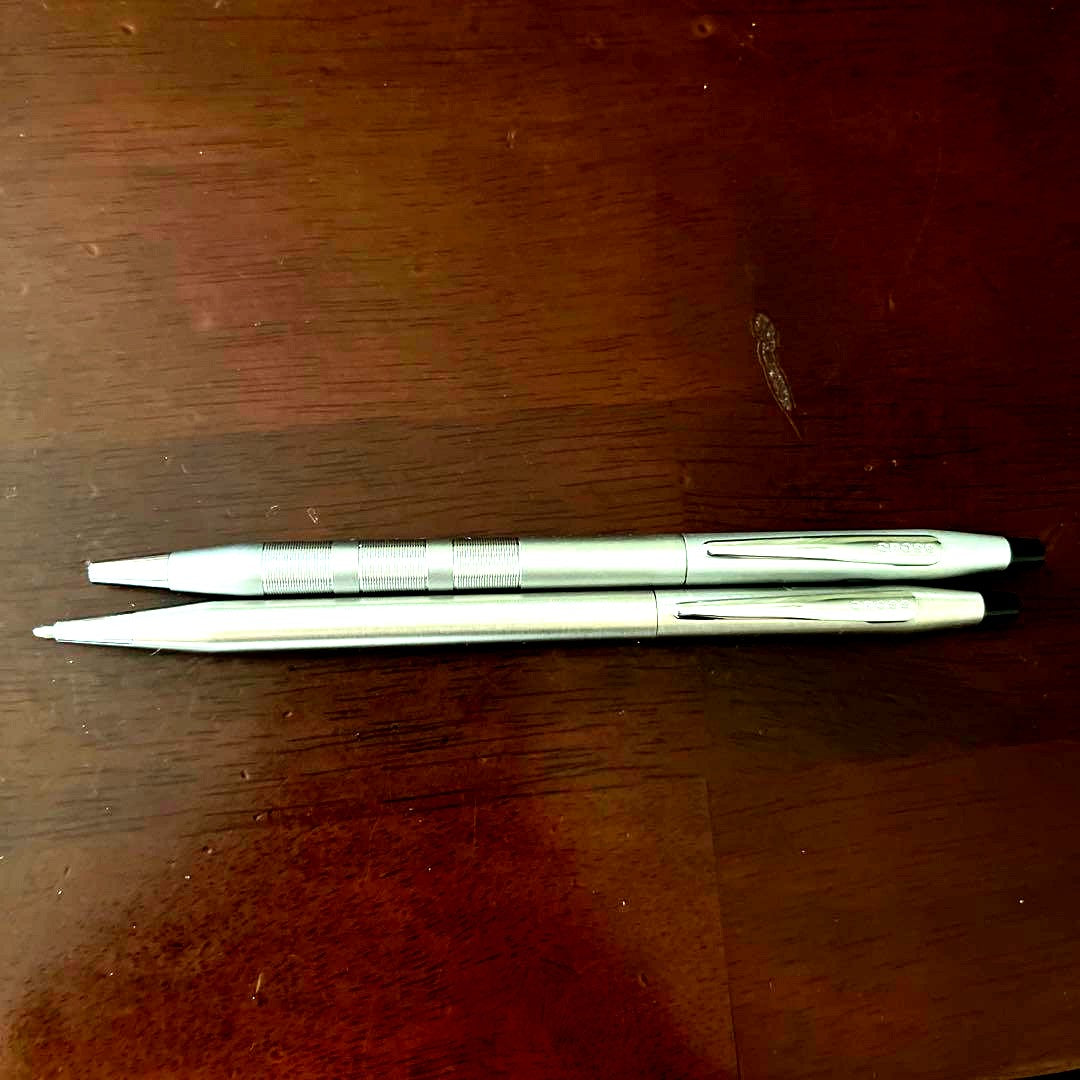 Used CROSS ballpoint fountain pen with sleek silver finish shown from side angle