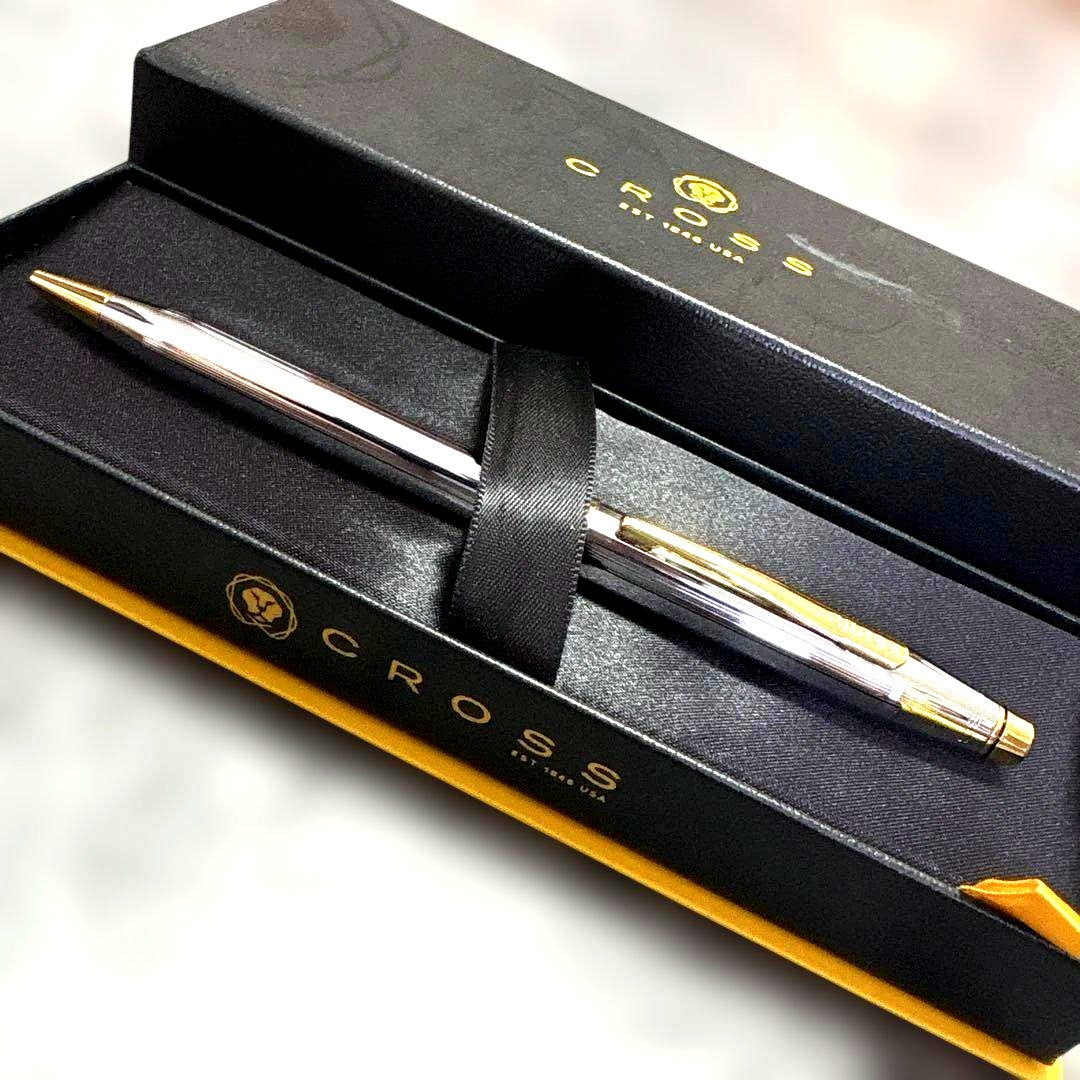 Cross Classic Century Medalist ballpoint pen with silver body, gold clip and cap top, chrome plated finish
