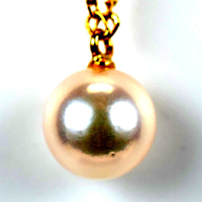 Mikimoto necklace with single 7mm Akoya pearl on 18K yellow gold chain, 40cm length, Mikimoto engraving visible