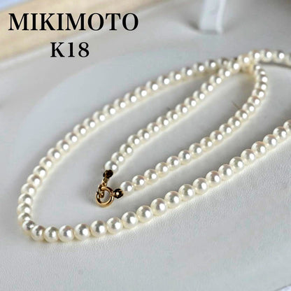 Mikimoto Akoya pearl necklace with round baby pearls on 18-karat yellow gold chain, 36cm length