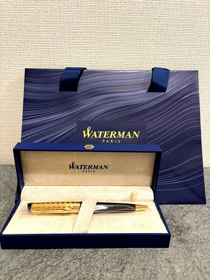Waterman black and gold ballpoint pen with gold cap, included case and paper bag