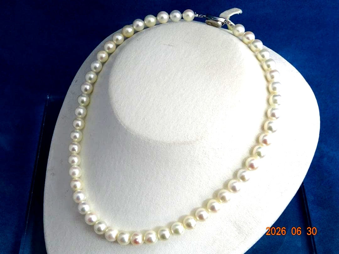 Akoya pearl necklace with 8-8.5mm white semi-round pearls showing subtle pink and cream tones