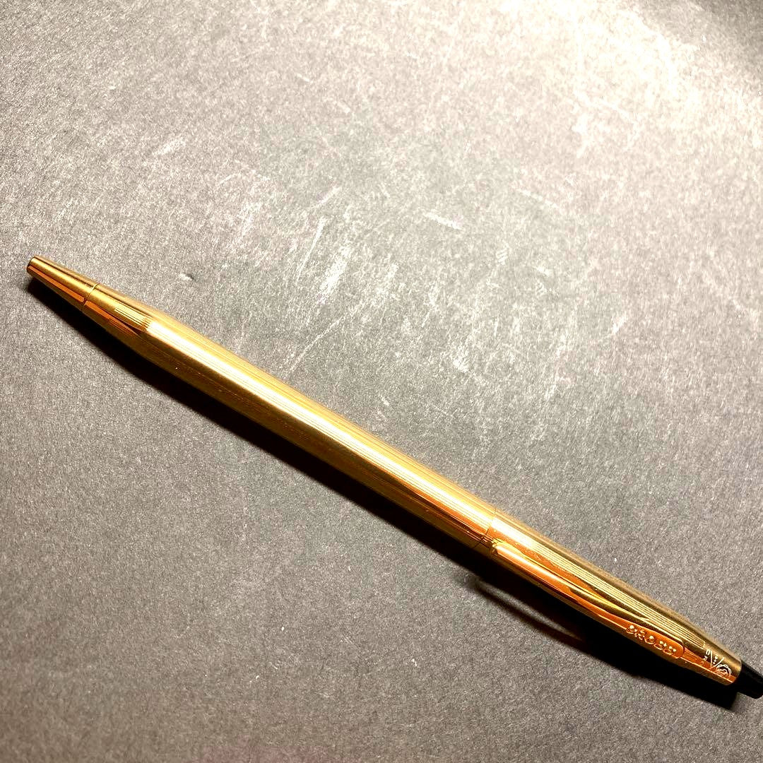 Cross Classic Century gold ballpoint pen in used condition with sleek design