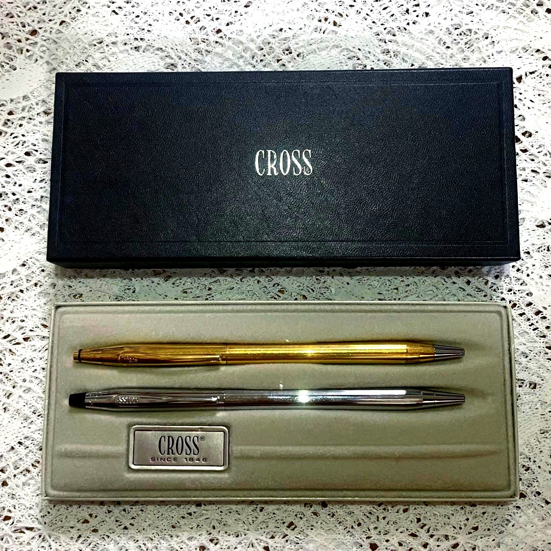 Set of two Cross ballpoint pens with 0.5mm refill, silver USA pen and gold Ireland pen in box, used condition