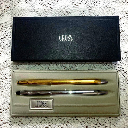 Set of two Cross ballpoint pens with 0.5mm refill, silver USA pen and gold Ireland pen in box, used condition
