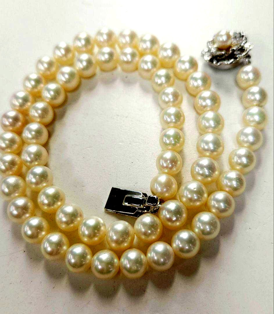 Akoya Pearl Necklace featuring 7 mm white pearl beads, 42 cm length, laid out on a white background