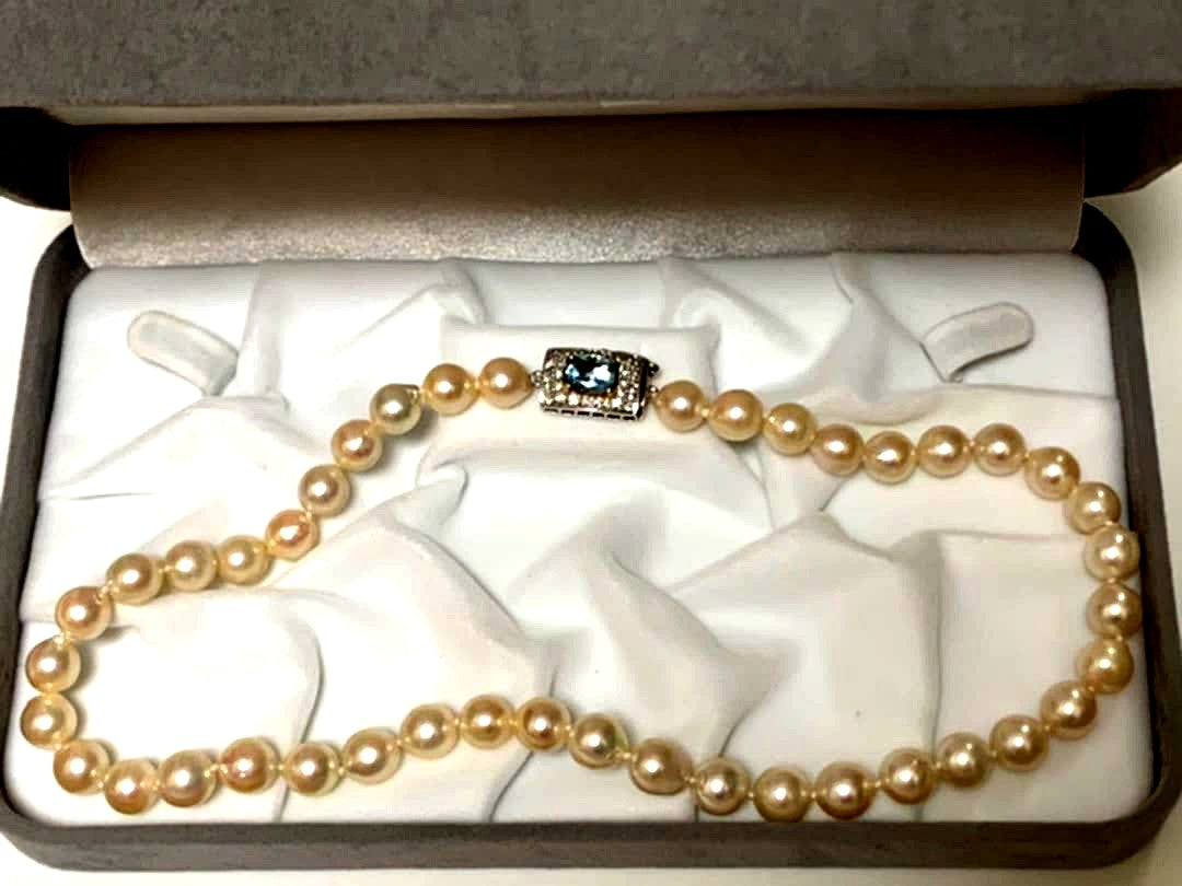 Akoya pearl baroque necklace with 42 pearls, K18WG YG clasp, and a large aquamarine stone