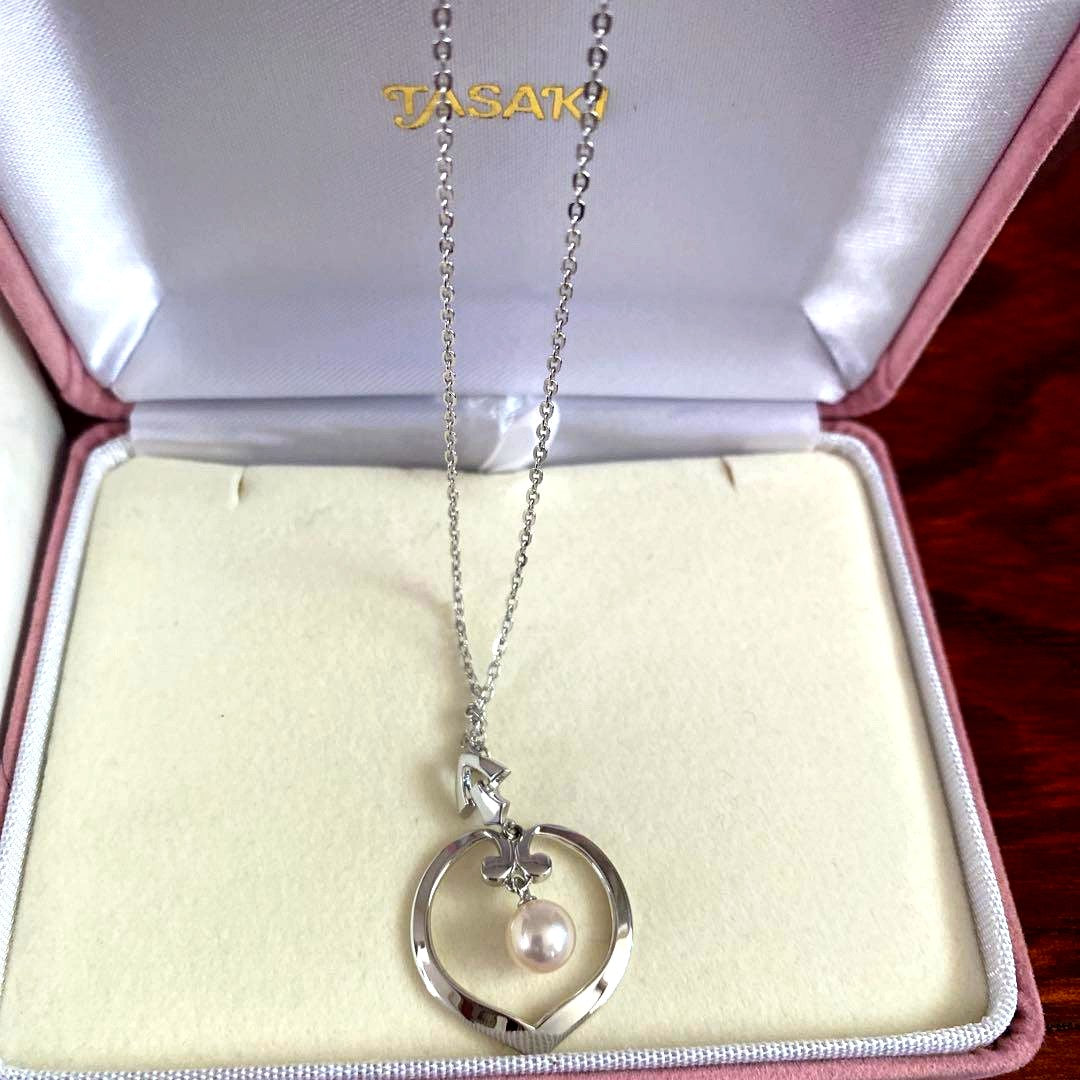 Silver TASAKI freshwater pearl pendant with certificate included on white background