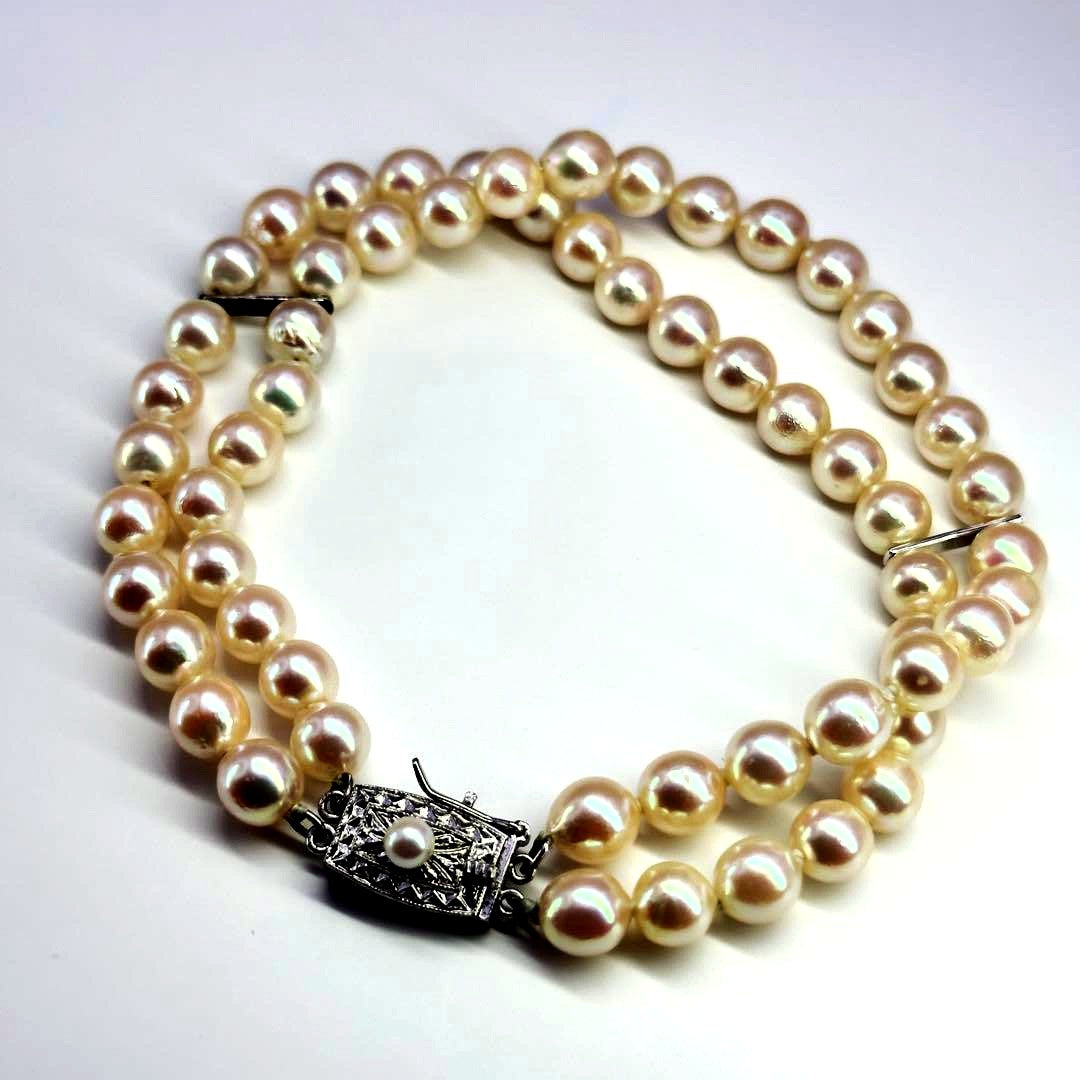 Tasaki silver 2-strand bracelet with approximately 6.0-6.2mm pearls measuring about 19cm
