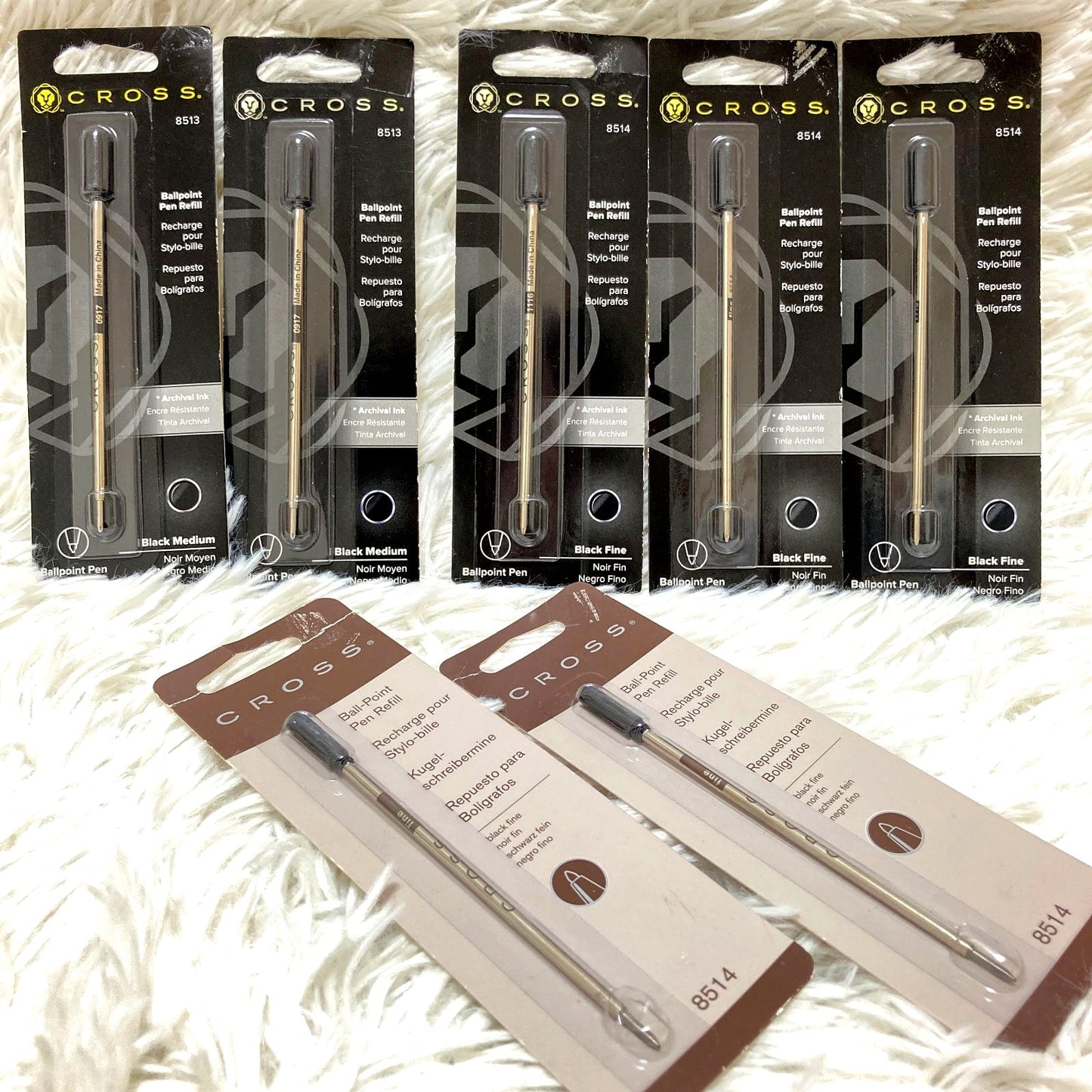Set of seven CROSS Kuro ballpoint pen refills in black and brown with model numbers 8513 and 8514