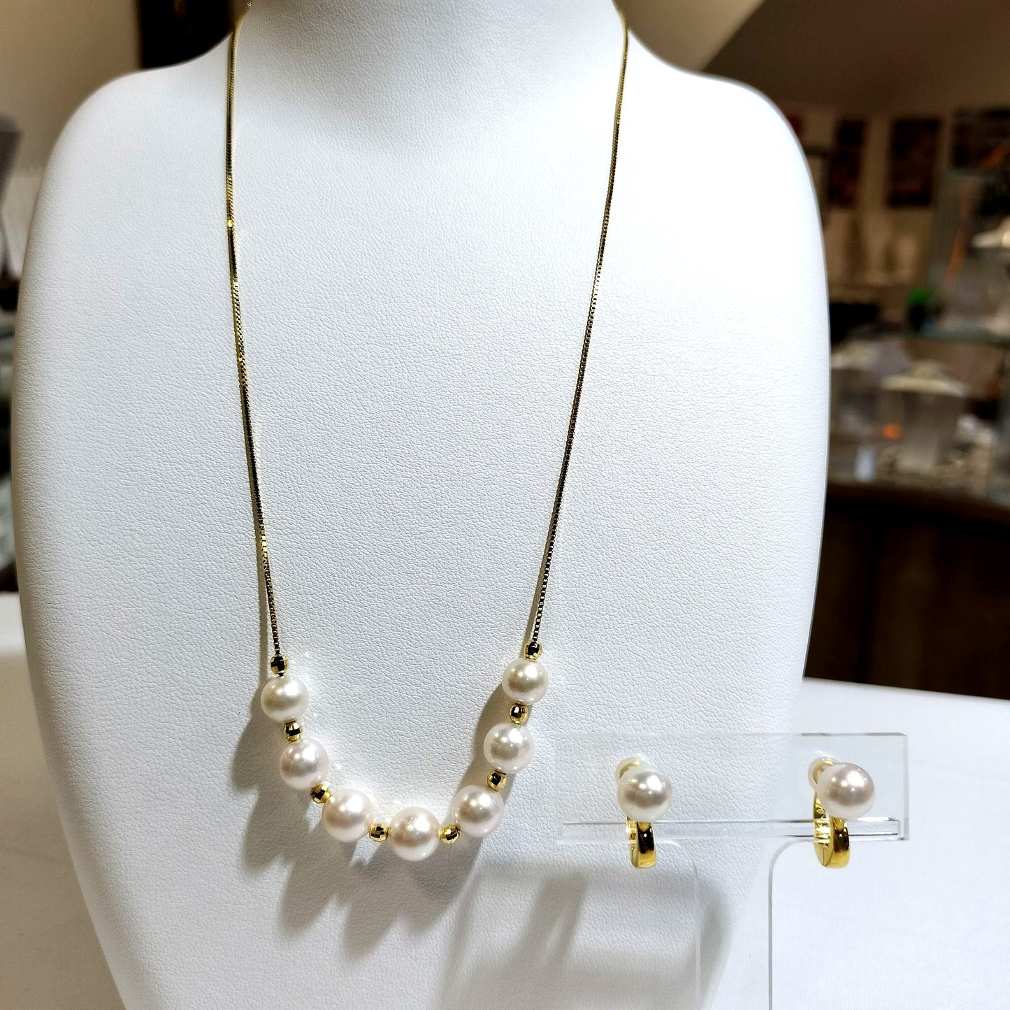 Akoya pearl necklace with 7-7.5 mm pearls and matching 7.5 mm pearl earrings on white background
