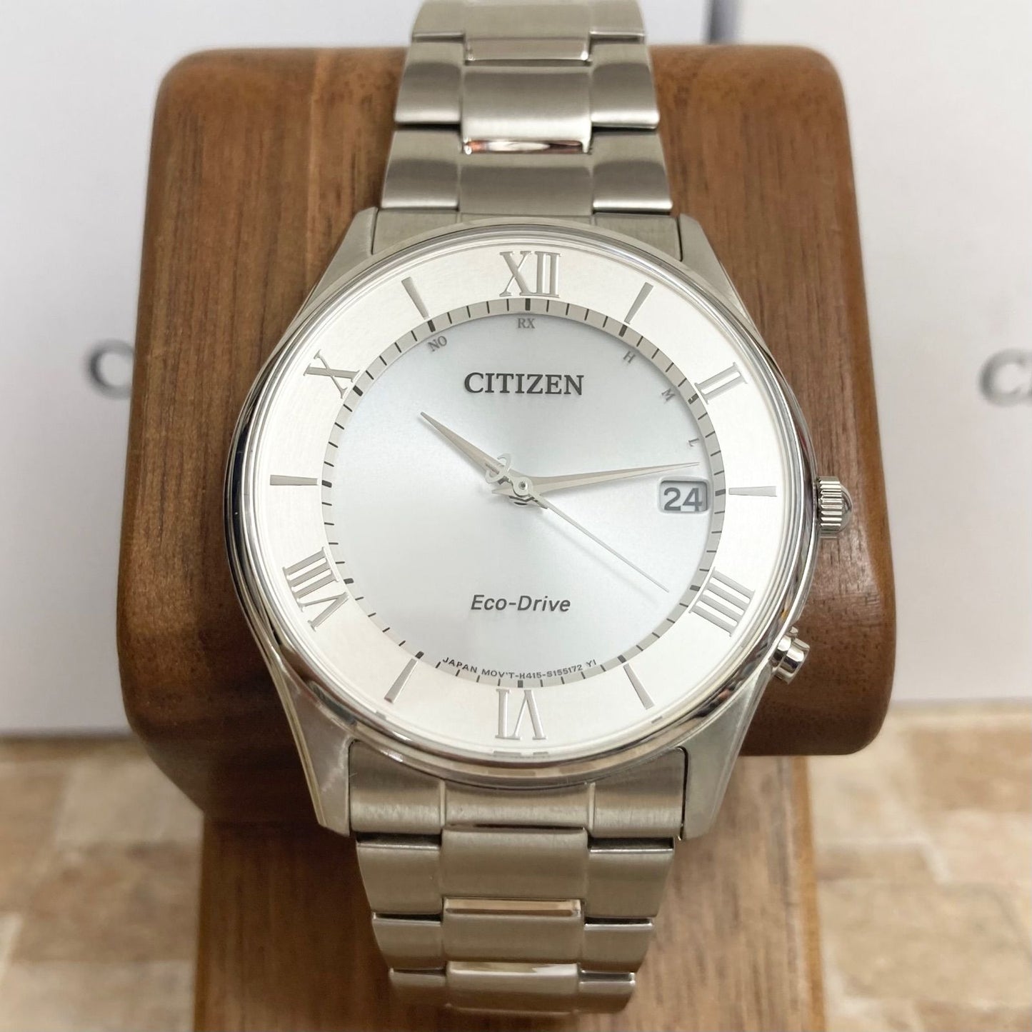 Citizen Eco-Drive men's radio-controlled watch model H415-S112907 with silver case and black band