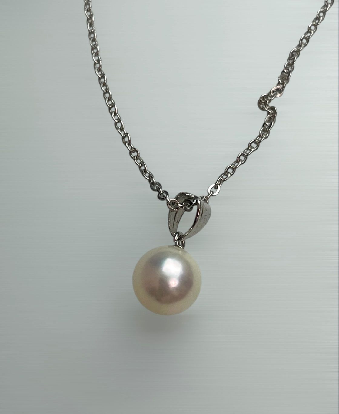 Akoya pearl necklace with a single 8.5mm white pearl on a silver chain