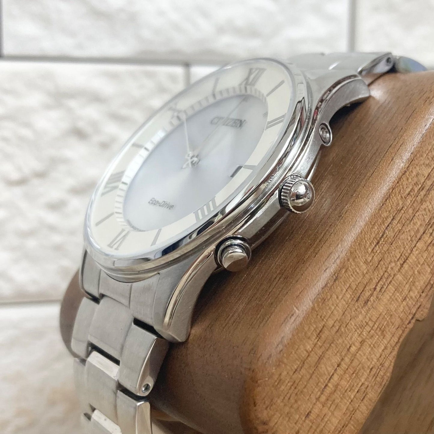 Citizen Eco-Drive men's radio-controlled watch model H415-S112907 with silver case and black band