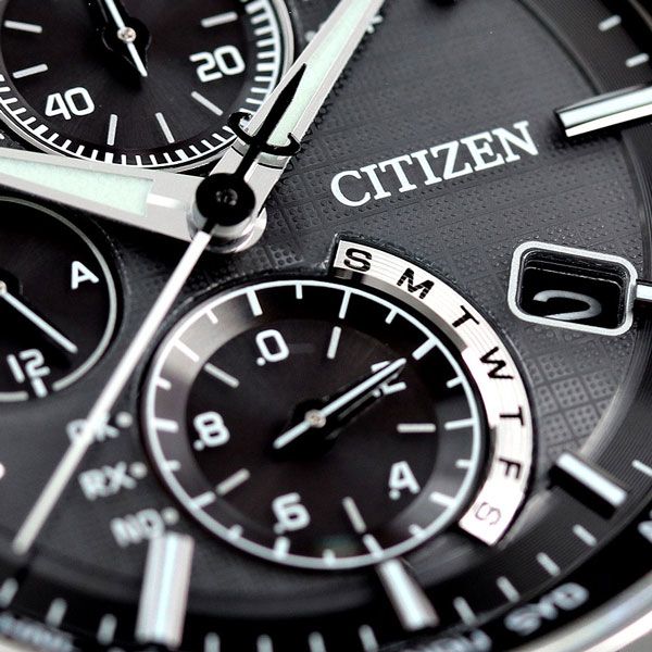 Citizen Attesa AT8040-57E watch with black dial and silver titanium band on a white background