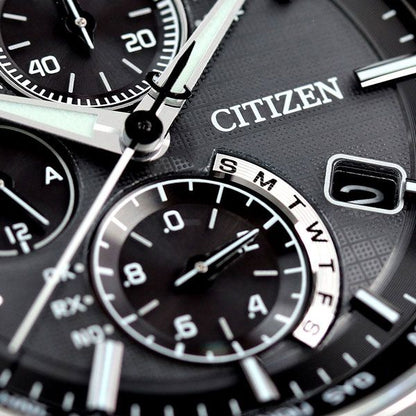Citizen Attesa AT8040-57E watch with black dial and silver titanium band on a white background