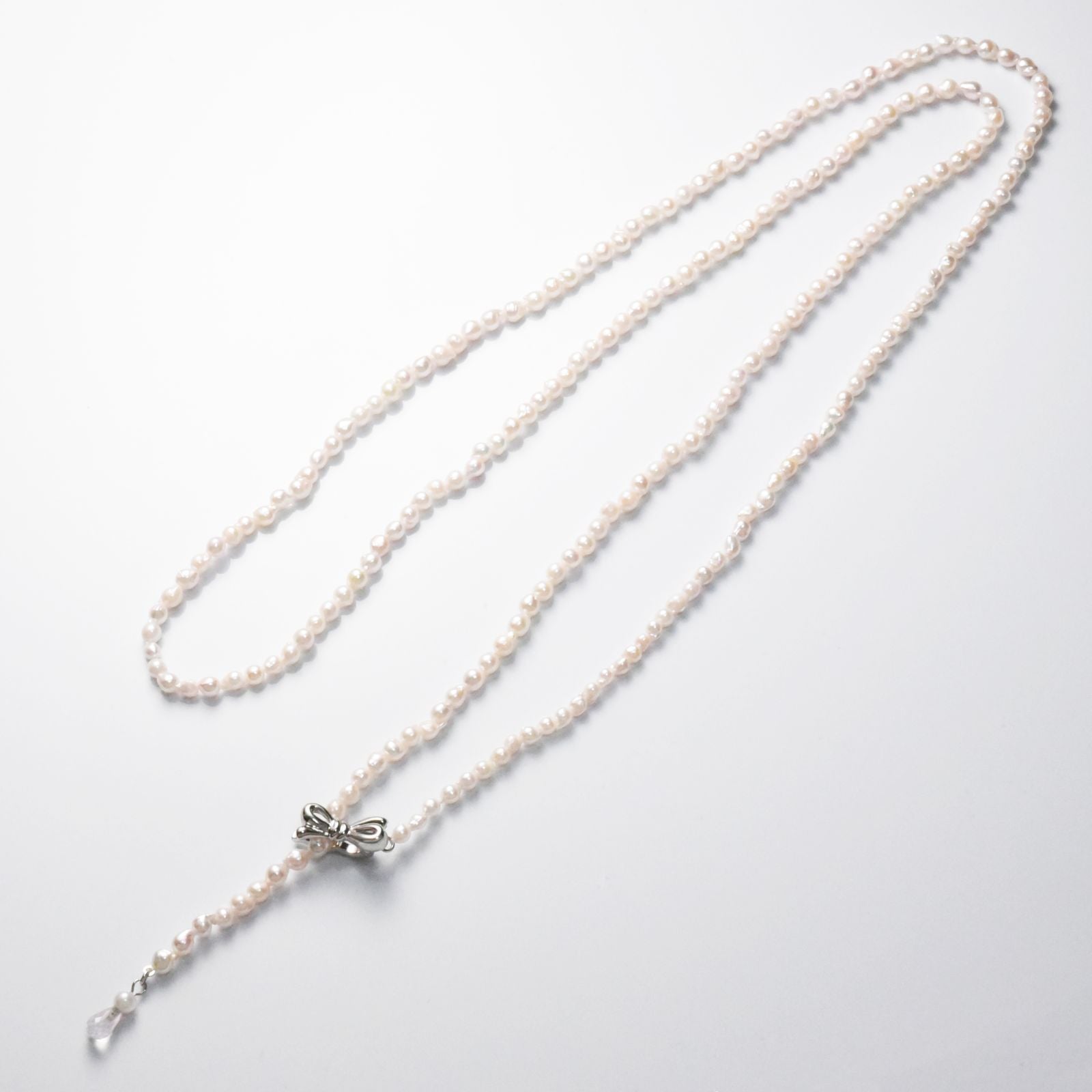 Baroque shape Akoya pearl necklace with 3-3.5mm pearls and rose quartz ribbon clasp, 80cm long