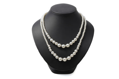 LunArts 2-row pearl necklace paired with matching pearl stud earrings on a white background